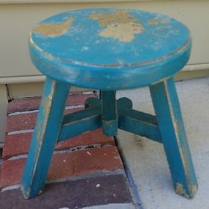 Blue chippy paint short wood stool